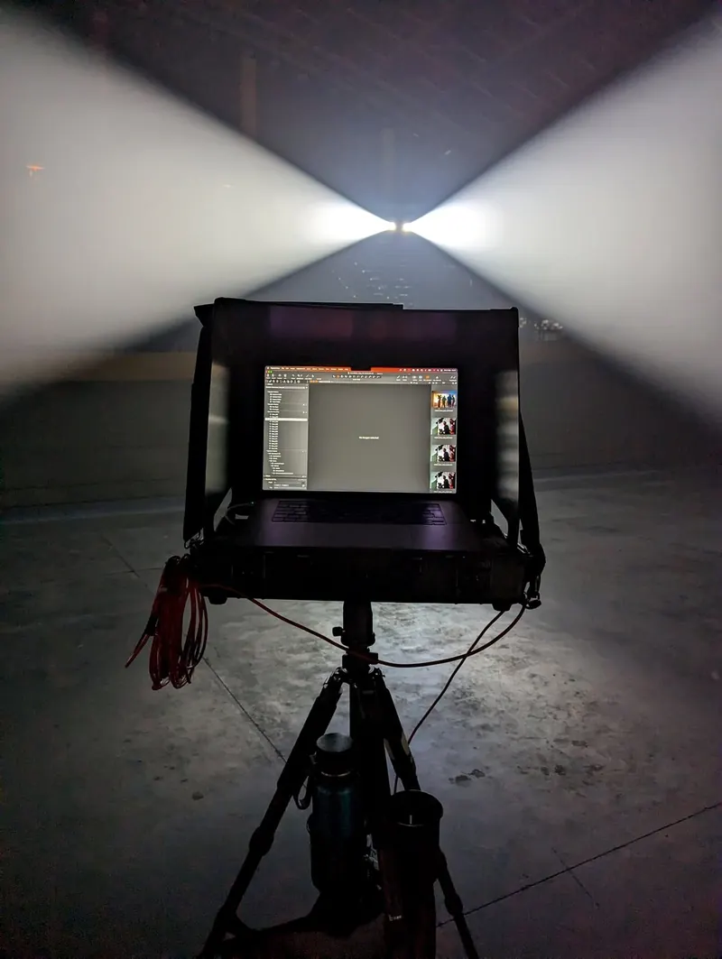 A tethered workstation lit at night